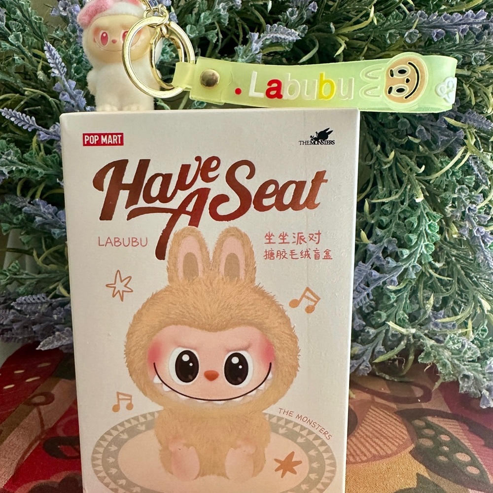 Popmart. Have A Seat Blind Box and a Labubu Keychain